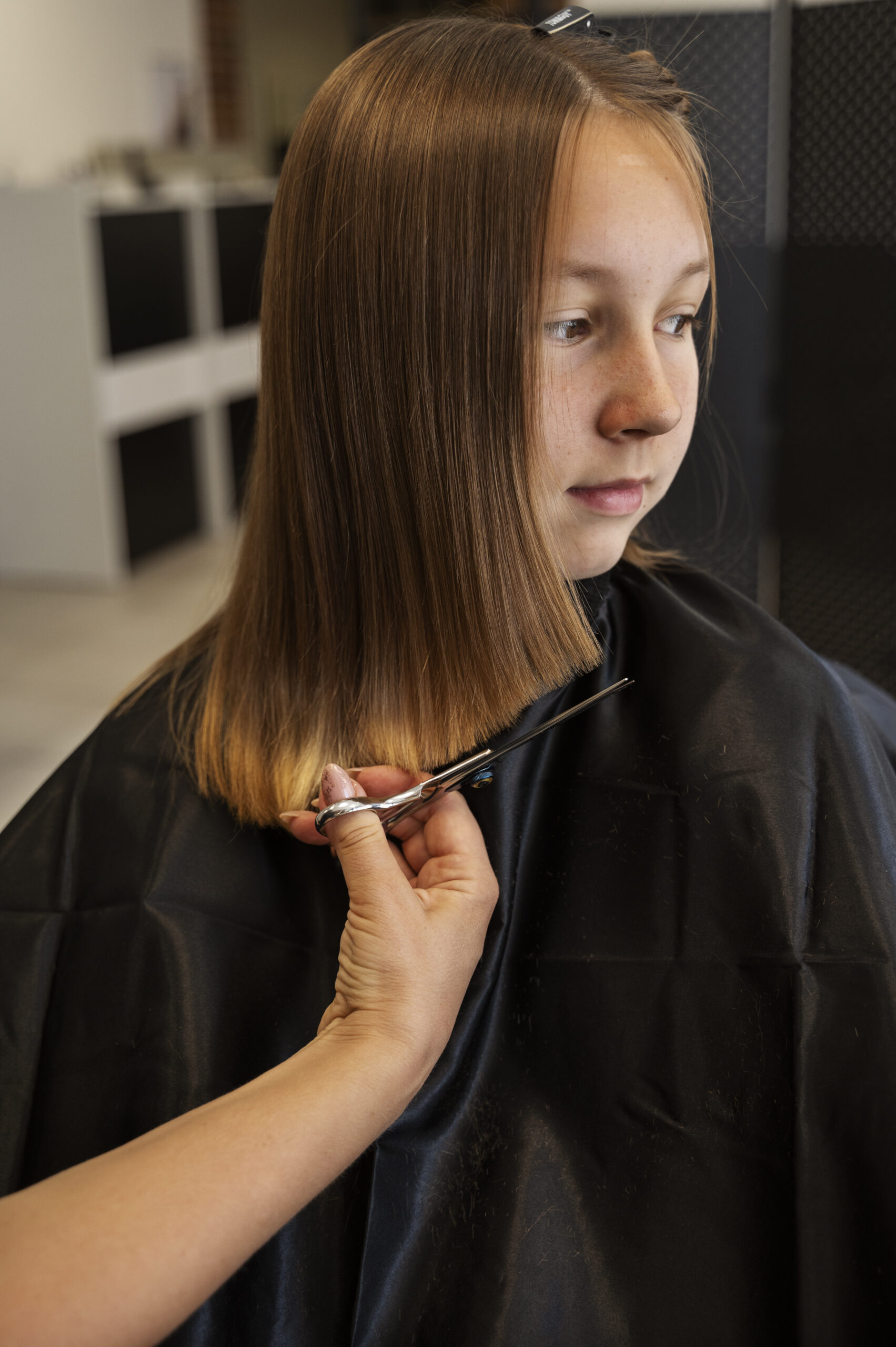 front-view-girl-getting-haircut-salon